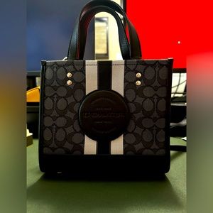 NEVER USED. Dempsey Carryall in signature Jacquard w/stripe and coach patch